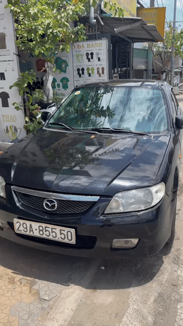 Mazda 323 2001 Đen. Mua bán Ô tô tại Quận Bình Tân Tp Hồ Chí Minh được đăng bởi Thu Hồng hình 1