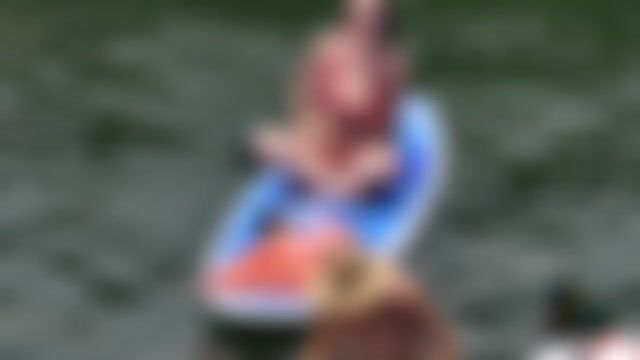 Paddleboarding in swimwear, normal water activity