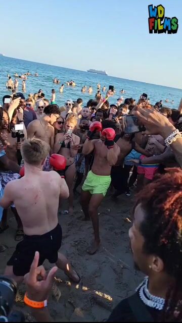 Beach boxing event crowd in swimwear