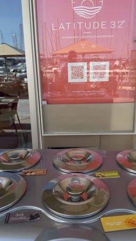 Latitude 32° sign and ice-cream counter