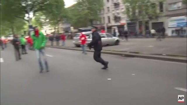 Protestor Knocks Out Police Officer