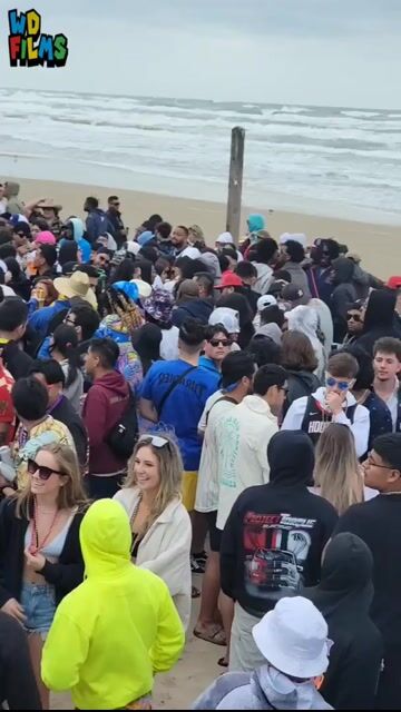 Beach crowd fully clothed, wide shots