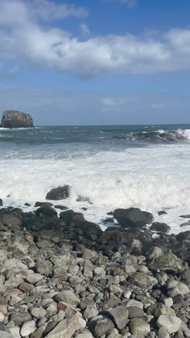 A Coastal Village Guarded by a Giant Rock