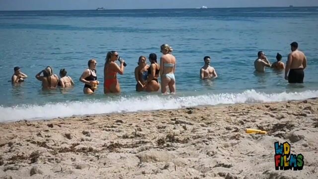 Beach crowds, normal swimwear
