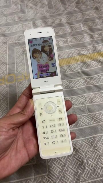 Điện thoại nắp gập Au Trắng Nhật Bản. Mua bán Điện thoại tại Thành phố Huế Thừa Thiên Huế được đăng bởi A Na hình 1