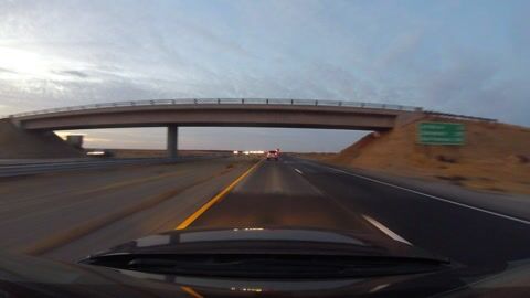 Example of thumbnail image generated from video of car driving down highway