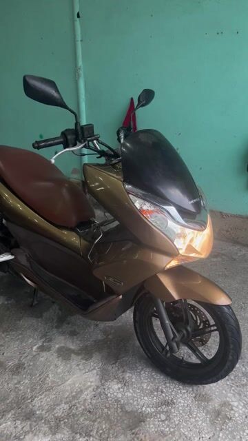 Honda PCX 2011 Vàng đồng. Mua bán Xe máy tại Huyện Bình Chánh Tp Hồ Chí Minh được đăng bởi NVT hình 1