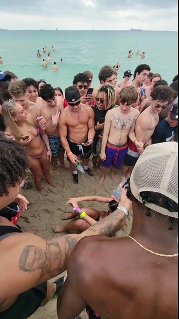 Large beach crowd, normal beach party