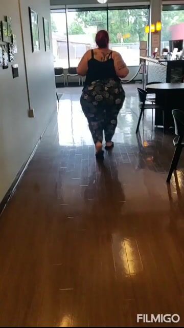 Woman walking, tank top + leggings, fully clothed