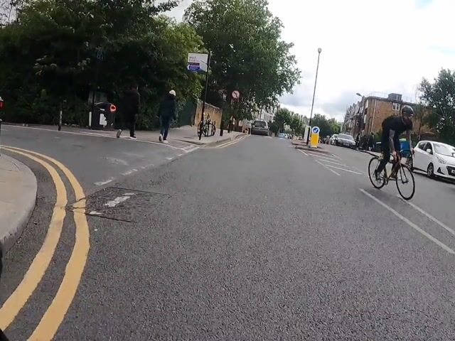 Driver quickly reversing the wrong way down a one way street - UpRide.cc