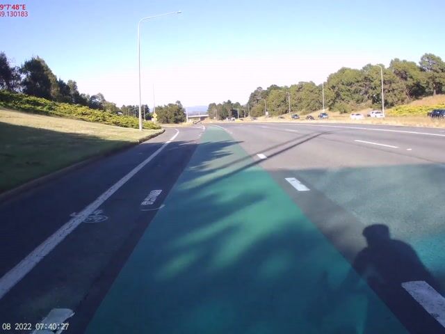Close high speed overtake onto an on-ramp cutting over cycle lane ...