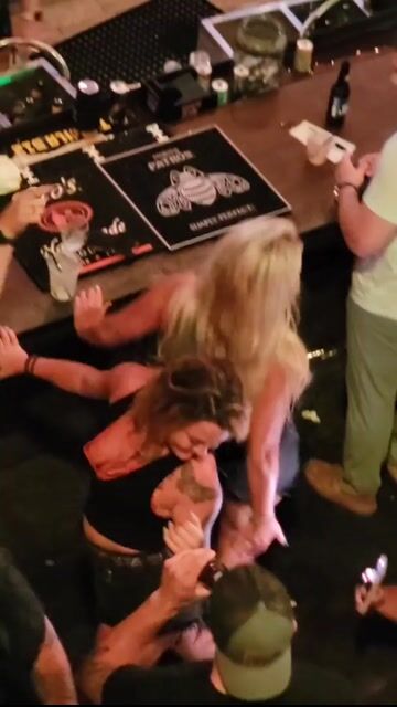 Bar crowd dancing, everyone clothed, normal framing